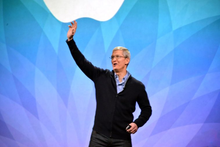 Apple's Tim Cook waves at the Apple Watch launch event. [Image Source: The Verge] -